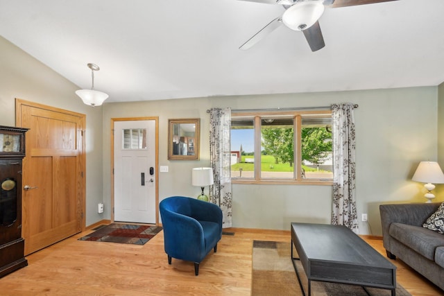 106 Prairie Grass Dr, Osceola, WI 54020 - living area with light wood finished floors, a ceiling fan, and vaulted ceiling