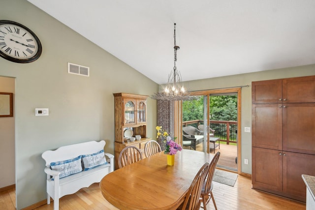 106 Prairie Grass Dr, Osceola, WI 54020 - dining area featuring a chandelier, light wood-style flooring, and high vaulted ceiling