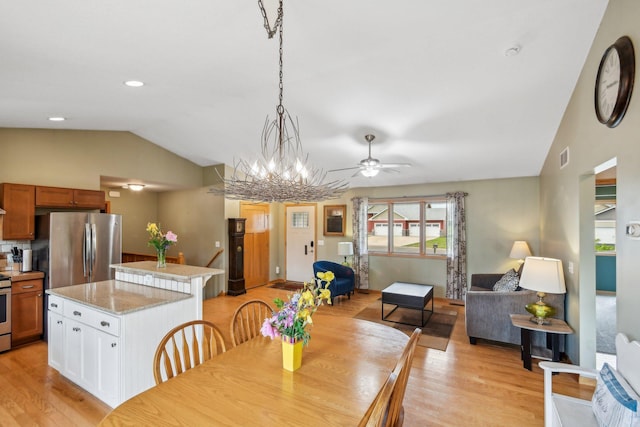 106 Prairie Grass Dr, Osceola, WI 54020 - dining room featuring vaulted ceiling, ceiling fan, and light wood-style floors