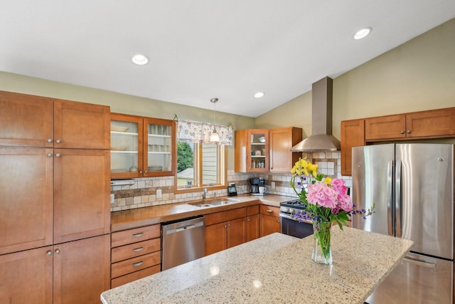 106 Prairie Grass Dr, Osceola, WI 54020 - kitchen featuring appliances with stainless steel finishes, wall chimney exhaust hood, backsplash, brown cabinets, and vaulted ceiling