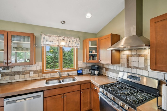 106 Prairie Grass Dr, Osceola, WI 54020 - kitchen featuring stainless steel appliances, wall chimney exhaust hood, brown cabinets, backsplash, and glass insert cabinets