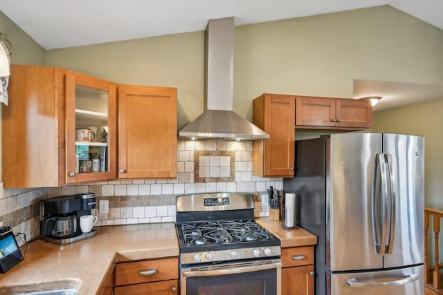 106 Prairie Grass Dr, Osceola, WI 54020 - kitchen featuring stainless steel appliances, wall chimney range hood, light countertops, lofted ceiling, and decorative backsplash