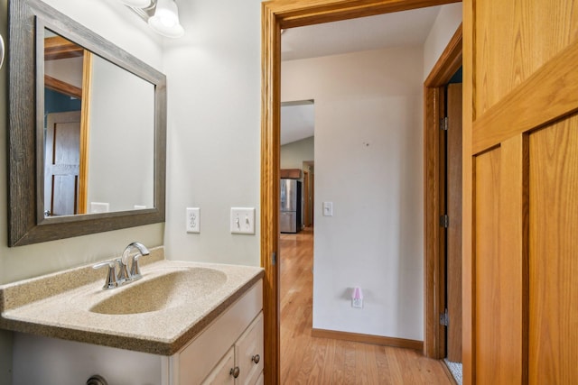 106 Prairie Grass Dr, Osceola, WI 54020 - bathroom featuring wood finished floors and vanity