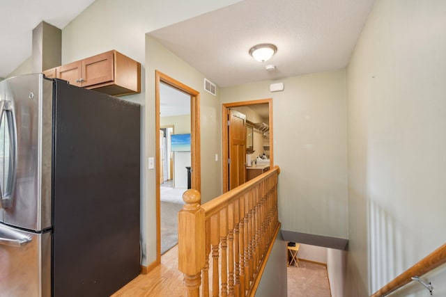 106 Prairie Grass Dr, Osceola, WI 54020 - kitchen featuring freestanding refrigerator and light wood finished floors