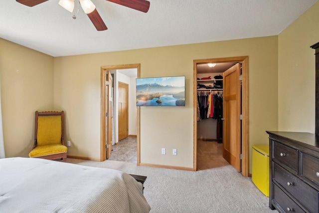 106 Prairie Grass Dr, Osceola, WI 54020 - bedroom featuring a walk in closet, light colored carpet, a closet, and ceiling fan
