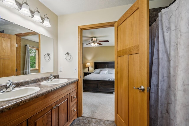 106 Prairie Grass Dr, Osceola, WI 54020 - ensuite bathroom featuring double vanity and ceiling fan