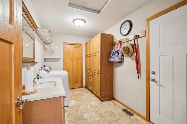 106 Prairie Grass Dr, Osceola, WI 54020 - laundry area with cabinet space, washer and clothes dryer, and a textured ceiling