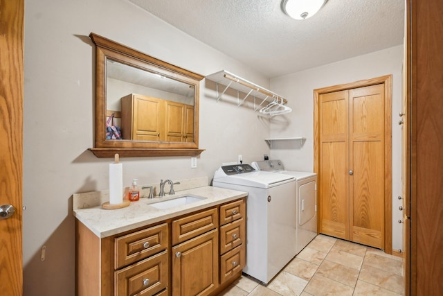 106 Prairie Grass Dr, Osceola, WI 54020 - laundry room with cabinet space, washing machine and dryer, a textured ceiling, and light tile patterned flooring