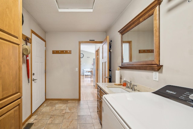 106 Prairie Grass Dr, Osceola, WI 54020 - bathroom featuring washer / dryer and vanity