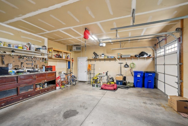 106 Prairie Grass Dr, Osceola, WI 54020 - garage featuring a garage door opener and a workshop area