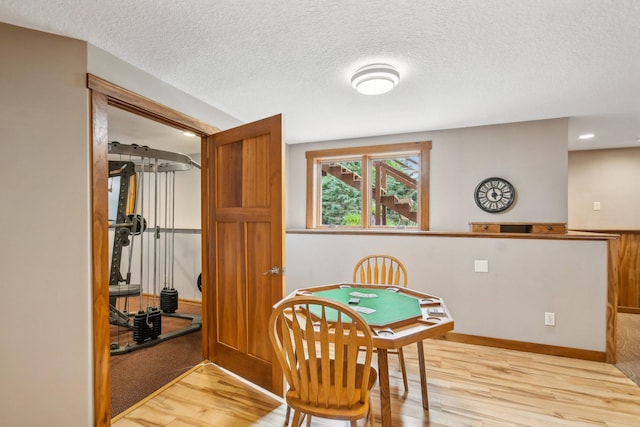 106 Prairie Grass Dr, Osceola, WI 54020 - dining room with wood finished floors, a textured ceiling, and recessed lighting