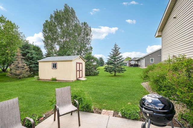 106 Prairie Grass Dr, Osceola, WI 54020 - view of grassy yard with a storage shed and a patio area