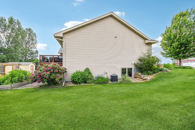 106 Prairie Grass Dr, Osceola, WI 54020 - view of side of property featuring a storage unit, a yard, and a wooden deck