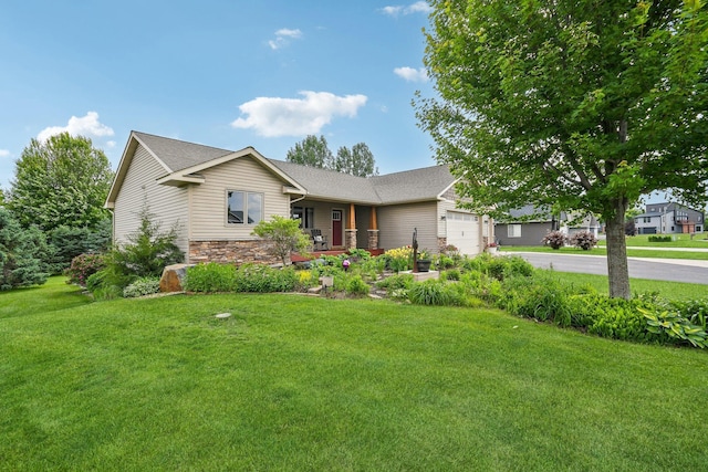 106 Prairie Grass Dr, Osceola, WI 54020 - ranch-style home with an attached garage, covered porch, driveway, a front yard, and stone siding