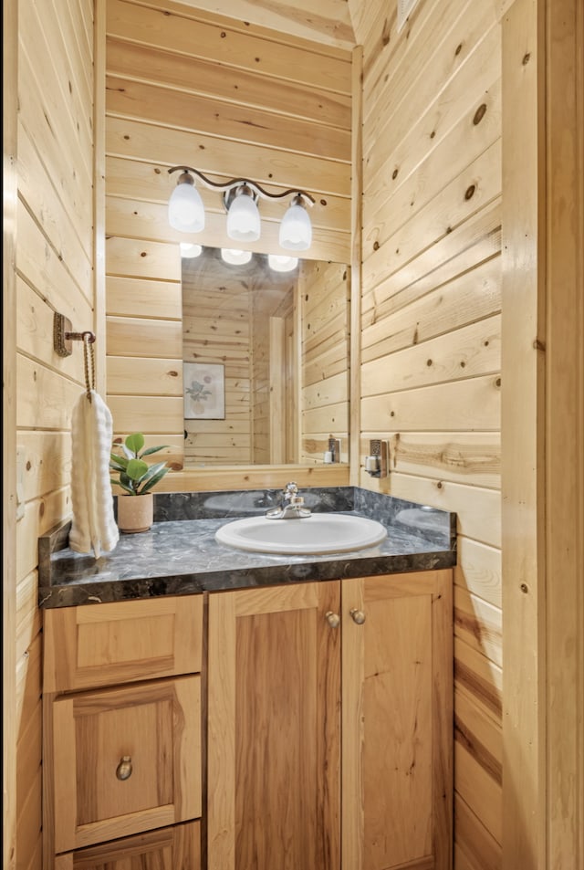 19381 Upland St NW, Elk River, MN 55330 - bathroom featuring wooden walls and vanity