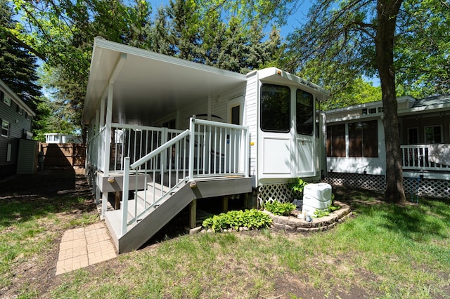 5181 Fish Hook Dr SW Unit 44, Lake Mary Twp, MN 56308 - rear view of property with a wooden deck, a lawn, and stairs