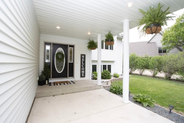 2109 Haughton Ave, North Mankato, MN 56003 - entrance to property featuring a yard and covered porch