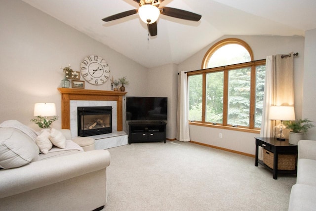 2109 Haughton Ave, North Mankato, MN 56003 - living area with a ceiling fan, lofted ceiling, a fireplace, light carpet, and baseboards