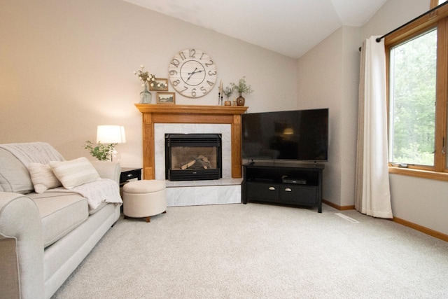 2109 Haughton Ave, North Mankato, MN 56003 - living room with vaulted ceiling, carpet, a premium fireplace, healthy amount of natural light, and baseboards