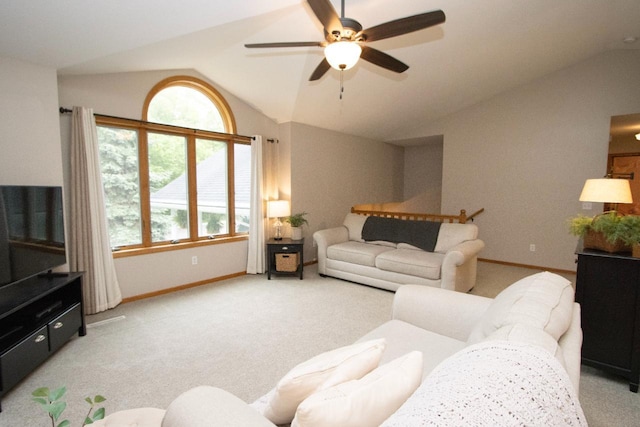 2109 Haughton Ave, North Mankato, MN 56003 - carpeted living room with lofted ceiling, a ceiling fan, and baseboards