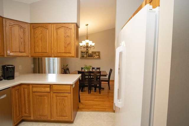 2109 Haughton Ave, North Mankato, MN 56003 - kitchen with dishwasher, a chandelier, light countertops, brown cabinets, and a peninsula