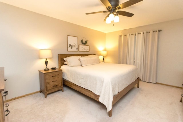 2109 Haughton Ave, North Mankato, MN 56003 - bedroom with light carpet, baseboards, and a ceiling fan
