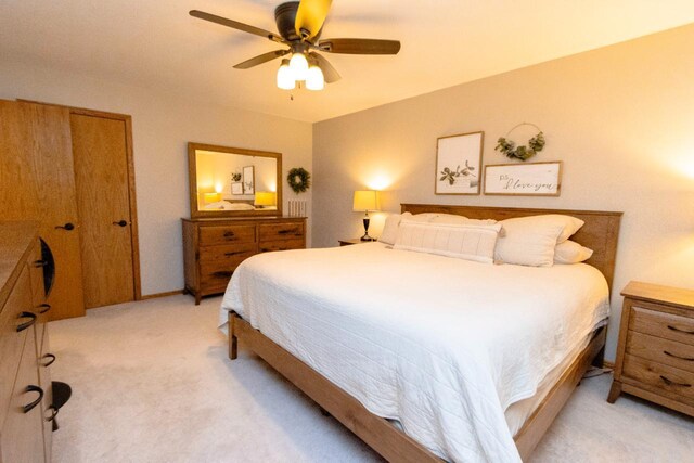 2109 Haughton Ave, North Mankato, MN 56003 - bedroom featuring light carpet, a ceiling fan, and baseboards