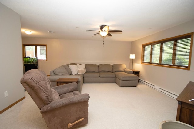 2109 Haughton Ave, North Mankato, MN 56003 - carpeted living area with a baseboard heating unit, a ceiling fan, and baseboards