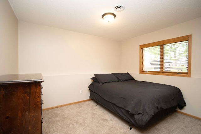 2109 Haughton Ave, North Mankato, MN 56003 - bedroom featuring light carpet and baseboards