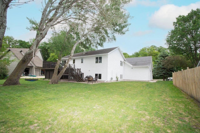 2109 Haughton Ave, North Mankato, MN 56003 - rear view of house with stairs, a deck, and a garage