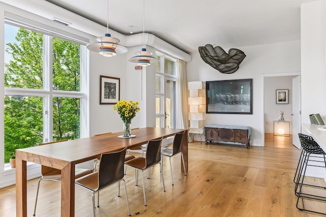 2845 Colfax Ave S Unit W305, Minneapolis, MN 55408 - dining area with light wood finished floors and plenty of natural light