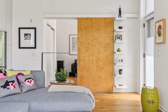 2845 Colfax Ave S Unit W305, Minneapolis, MN 55408 - sitting room featuring wood finished floors and baseboards