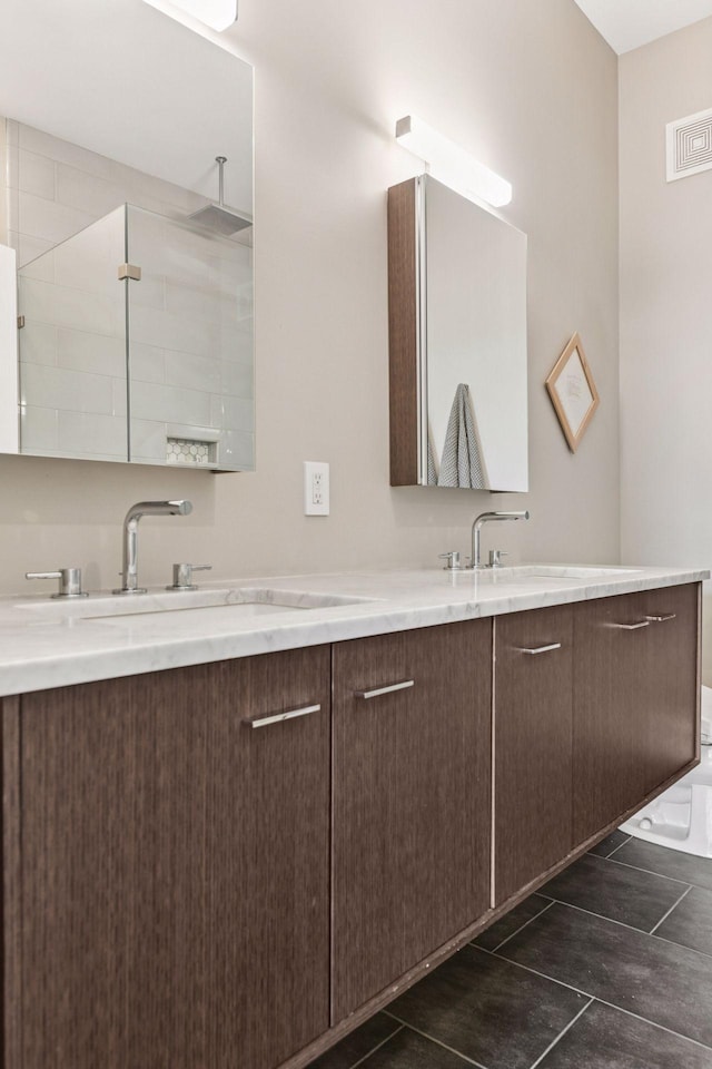 2845 Colfax Ave S Unit W305, Minneapolis, MN 55408 - bathroom featuring double vanity and tiled shower