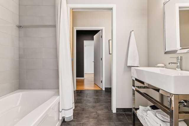 2845 Colfax Ave S Unit W305, Minneapolis, MN 55408 - bathroom featuring shower / bath combo with shower curtain and baseboards