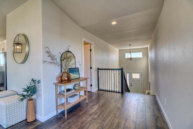 6242 87th Ave S, Horace, ND 58047 - hallway featuring a chandelier, dark wood finished floors, baseboards, an upstairs landing, and recessed lighting