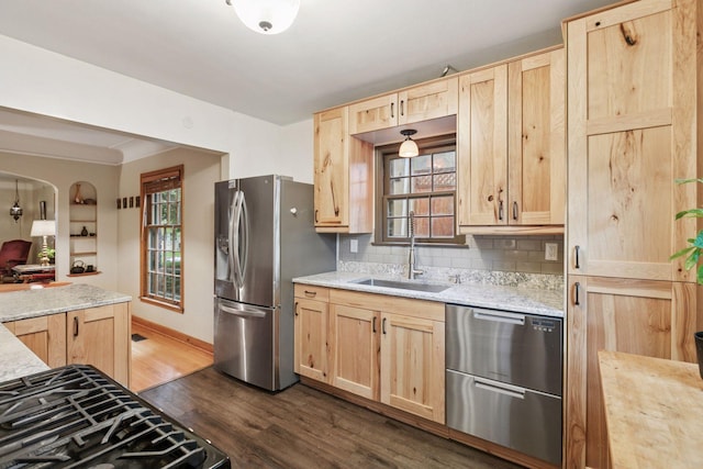 3527 Queen Ave N, Minneapolis, MN 55412 - kitchen featuring light brown cabinets, stainless steel appliances, dark wood-style floors, backsplash, and light stone countertops