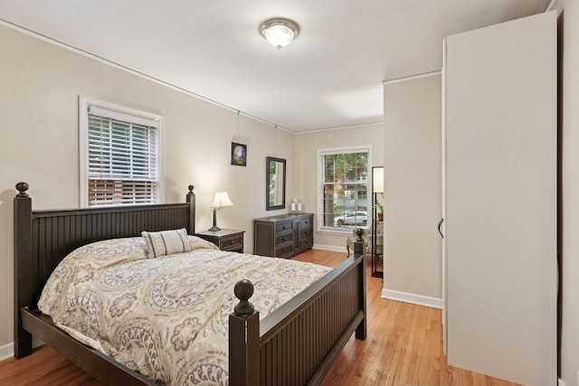 3527 Queen Ave N, Minneapolis, MN 55412 - bedroom featuring light wood finished floors and ornamental molding