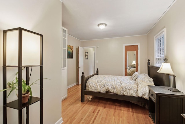 3527 Queen Ave N, Minneapolis, MN 55412 - bedroom featuring light wood-style floors and ornamental molding
