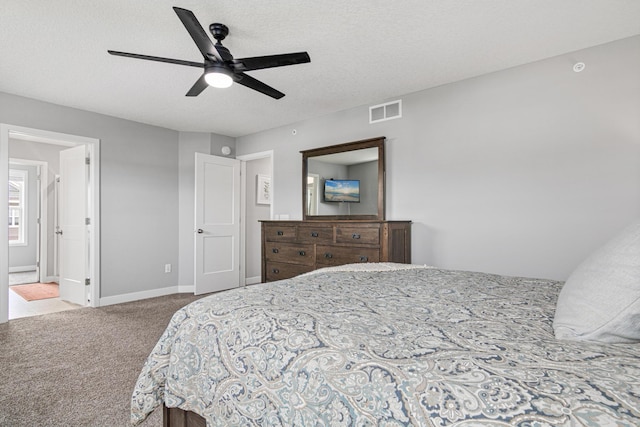 7243 Fall Dr, Lino Lakes, MN 55038 - bedroom with carpet, a textured ceiling, and ceiling fan