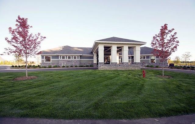 11444 Fieldstone Dr, Rogers, MN 55311 - prairie-style house with a front yard and stone siding