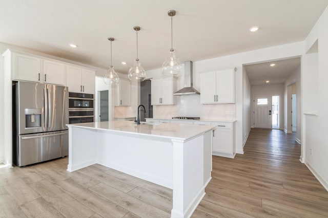 11444 Fieldstone Dr, Rogers, MN 55311 - kitchen with stainless steel refrigerator with ice dispenser, wall chimney range hood, gas cooktop, light wood-style flooring, and recessed lighting
