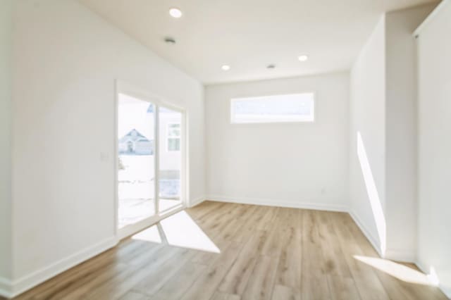 11444 Fieldstone Dr, Rogers, MN 55311 - spare room with light wood finished floors, baseboards, and recessed lighting