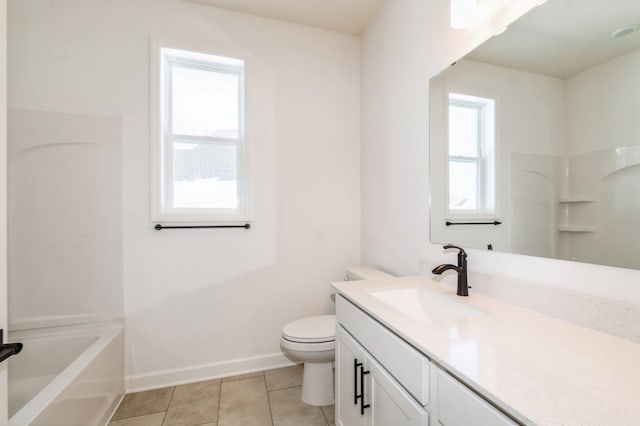 11444 Fieldstone Dr, Rogers, MN 55311 - bathroom with toilet, tile patterned flooring, vanity, and baseboards