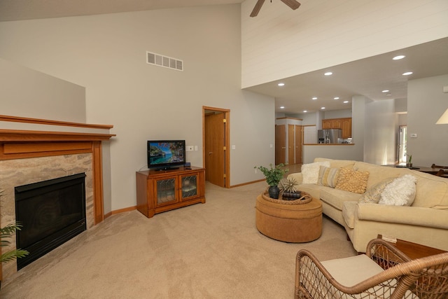 2804 Viola Heights Dr NE, Rochester, MN 55906 - living room with light carpet, baseboards, high vaulted ceiling, a ceiling fan, and a premium fireplace