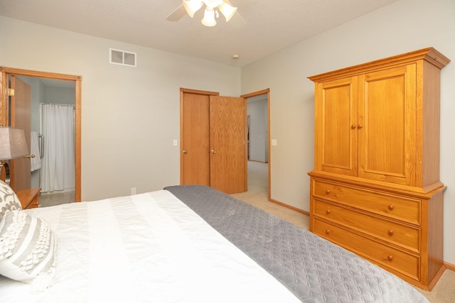 2804 Viola Heights Dr NE, Rochester, MN 55906 - bedroom featuring light carpet, ensuite bathroom, ceiling fan, and baseboards