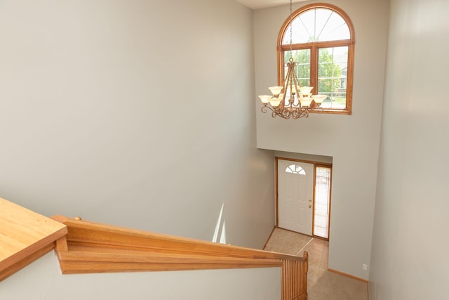 2804 Viola Heights Dr NE, Rochester, MN 55906 - carpeted foyer entrance featuring a chandelier and baseboards