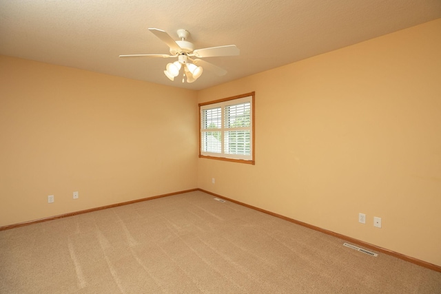 2804 Viola Heights Dr NE, Rochester, MN 55906 - empty room with ceiling fan, light colored carpet, and baseboards