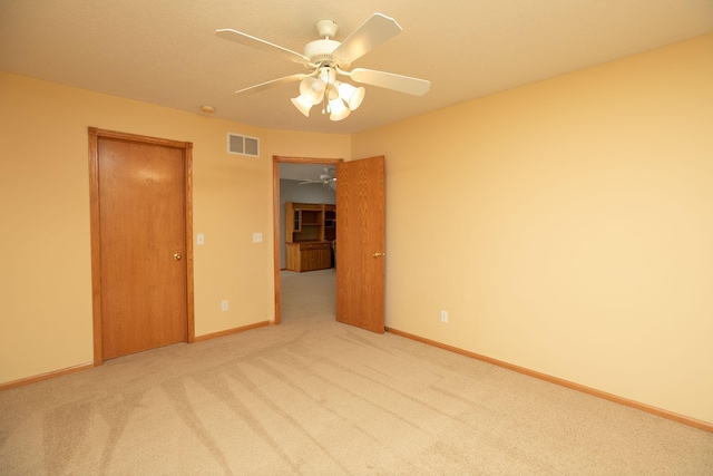 2804 Viola Heights Dr NE, Rochester, MN 55906 - empty room featuring light colored carpet, ceiling fan, and baseboards