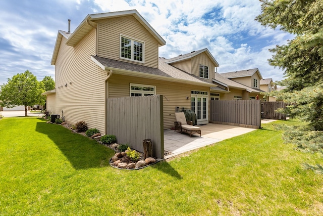 2804 Viola Heights Dr NE, Rochester, MN 55906 - back of property featuring a patio area, roof with shingles, central AC unit, and french doors