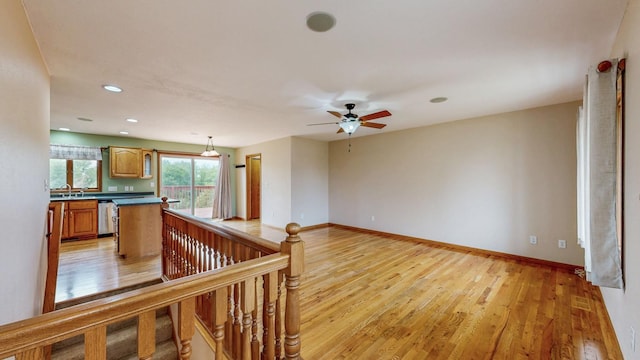 1364 Lone Stone Ct SE, Chatfield, MN 55923 - kitchen with dishwasher, light wood-style floors, dark countertops, recessed lighting, and baseboards